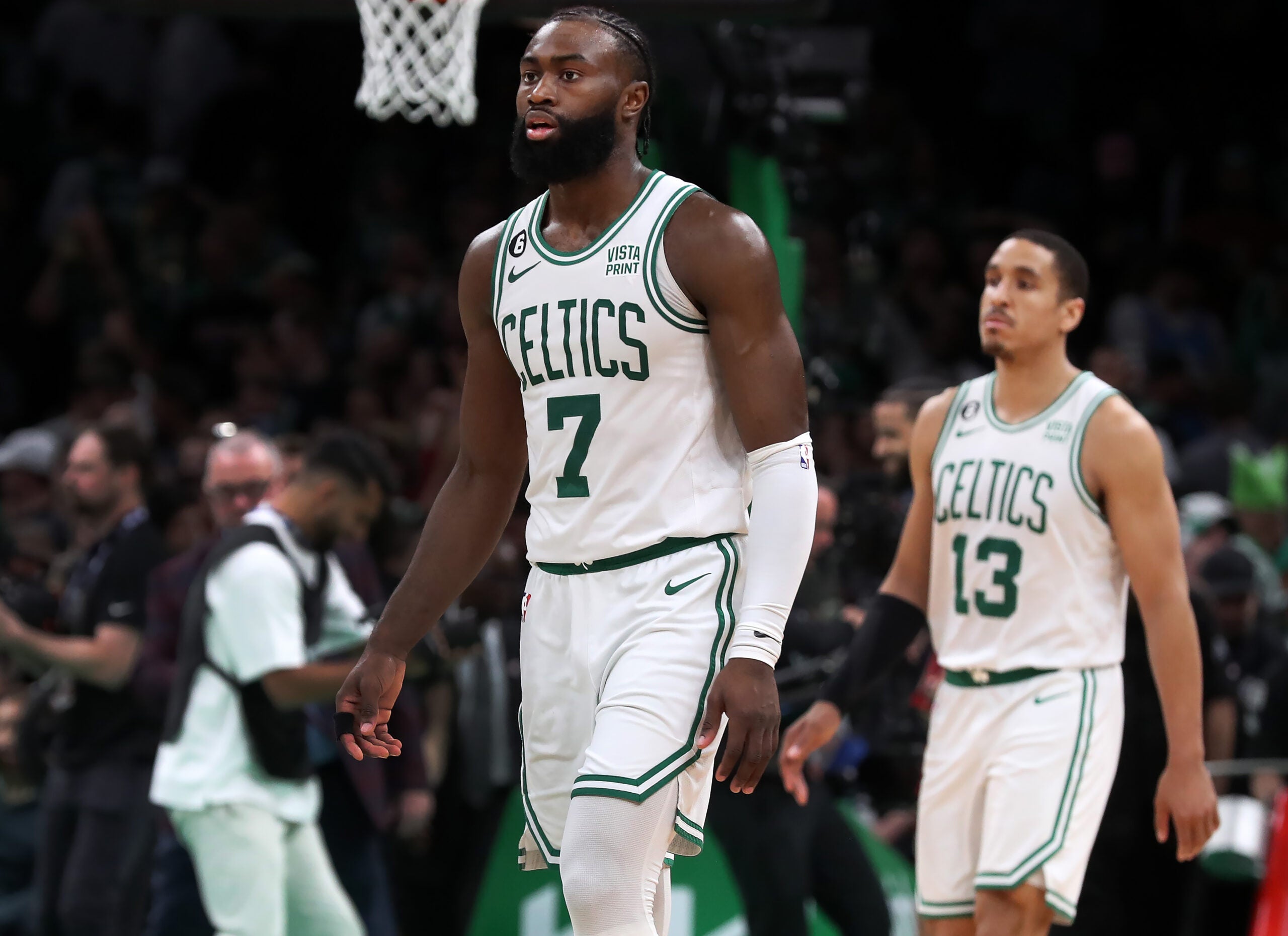 The Celtics Jaylen Brown (7) and Malcolm Brogdon (13) head off the court after the final horn sounded in Boston's loss.The Boston Celtics hosted the Miami Heat for Game Two of their NBA Eastern ConferenceFinals series at the TD Garden.