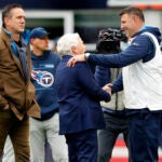 Pictured on the field together before the game are (left to right) former Patriots quarterback Drew Bledsoe, Patriots owner Robert Kraft and Titans head coach Mike Vrabel.