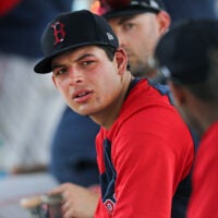 Red Sox infield prospect Nick Yorke is pictured in a dugout during a simulated game.