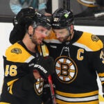 Boston -04/30/2023 Boston Bruins vs Florida Panthers-Game 7 - A teary-eyed David krejci(left) is hugged by Boston Bruins center Patrice Bergeron (37) at the end of their overtime loss.