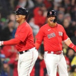 Justin Turner yells toward Rafael Devers in celebration