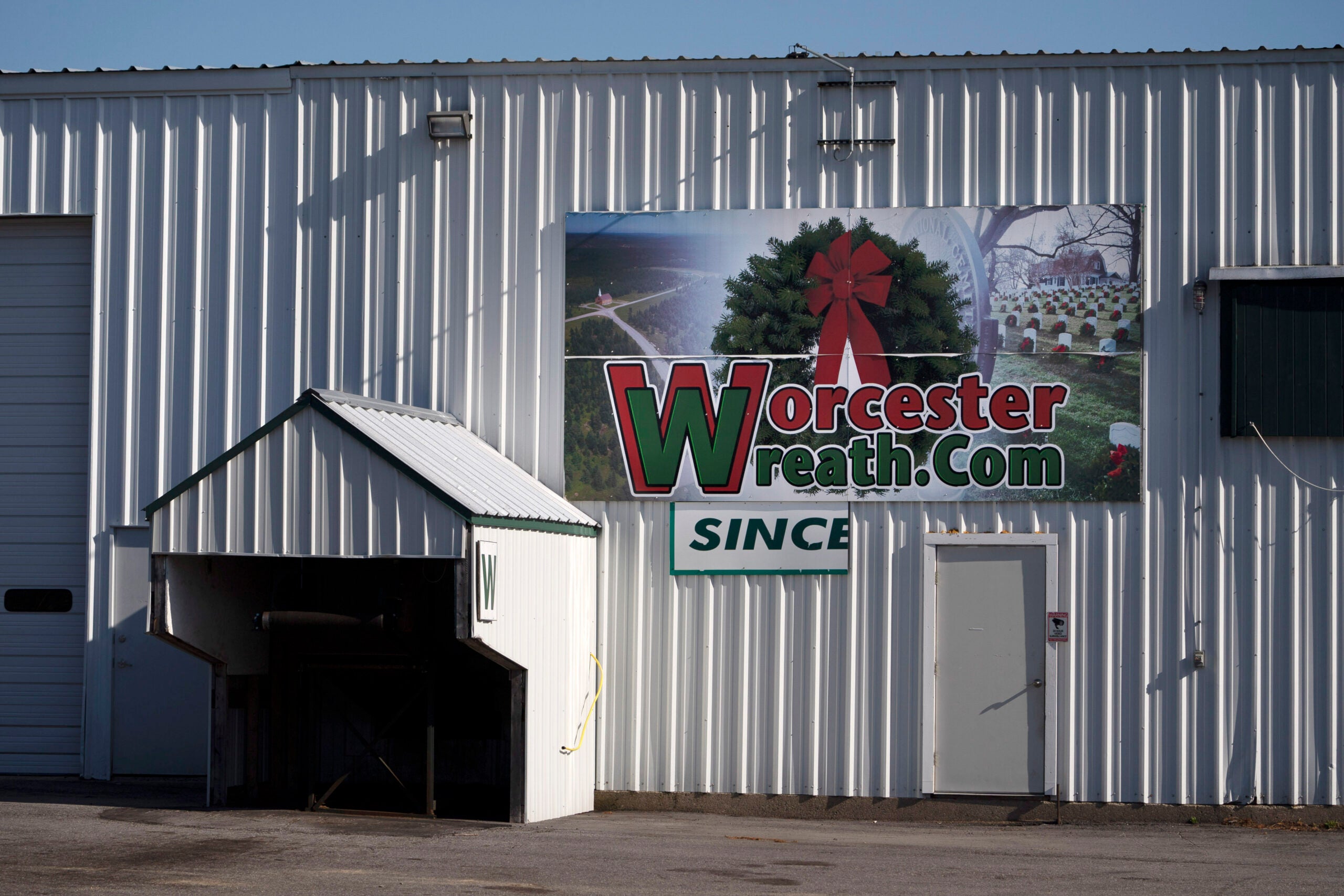A sign is seen on a Worcester Wreath building in Columbia Falls, Maine. 