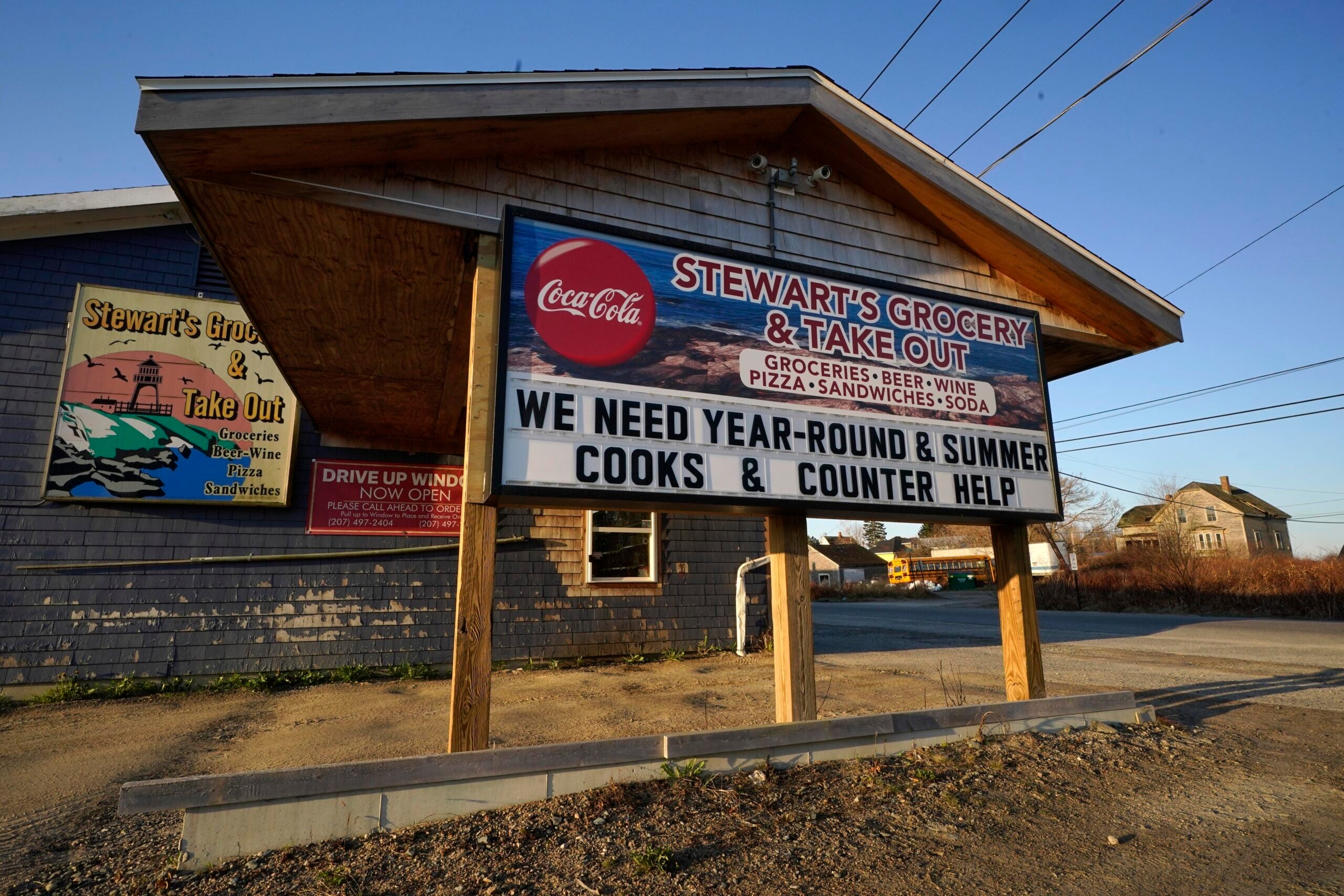 A sign advertises jobs at a small grocery store in Jonesport, Maine. 