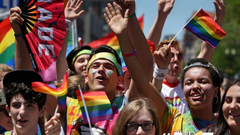 Members of Hopedale Gender Sexuality Alliance (GSA) cheer at the start of the Boston Pride Parade in Boston, MA on June 08, 2019.