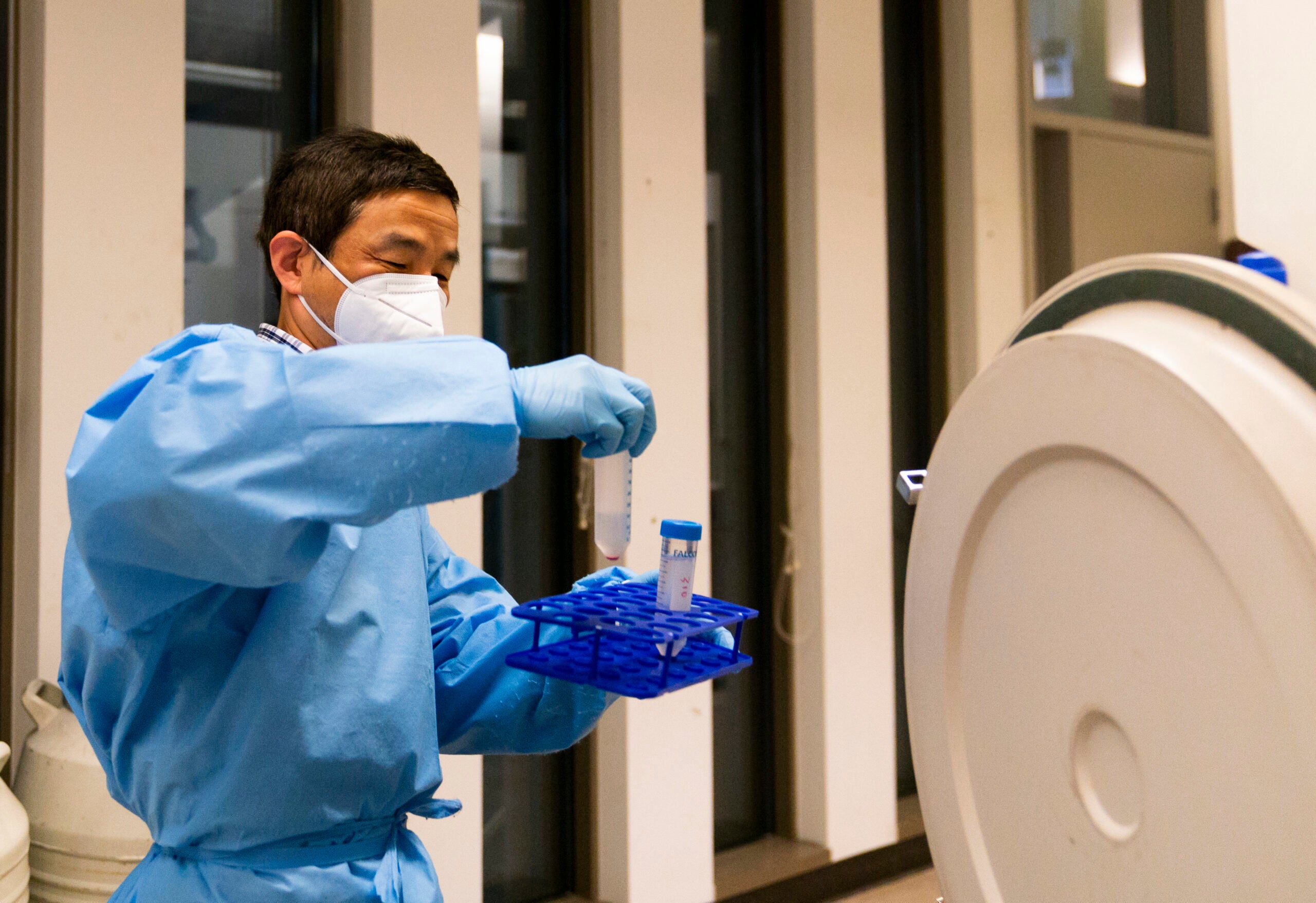 Research scientist Yi Yang retrieves samples at UW Medicine's Cancer Vaccine Institute in Seattle.