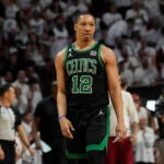 Boston Celtics forward Grant Williams (12) walks on the court during Game 3 of the NBA basketball playoffs Eastern Conference finals against the Miami Heat, Sunday, May 21, 2023, in Miami.