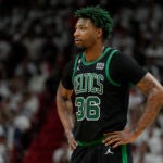 Boston Celtics guard Marcus Smart (36) stands on the court during the first half of Game 3 of the NBA basketball playoffs Eastern Conference finals against the Miami Heat, Sunday, May 21, 2023, in Miami.