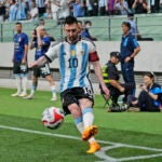 Argentina's Lionel Messi takes a corner kick during the friendly soccer match against Australia at the Workers' Stadium in Beijing.