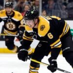 Boston Bruins' Mike Reilly (6) plays against the New Jersey Devils during the second period of a preseason NHL hockey game, Saturday, Oct. 8, 2022, in Boston.