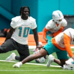 Tyreek Hill stretches during practice.