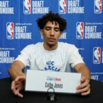 Colby Jones checks his name plate as he waits for the media during the 2023 NBA basketball Draft Combine in Chicago.