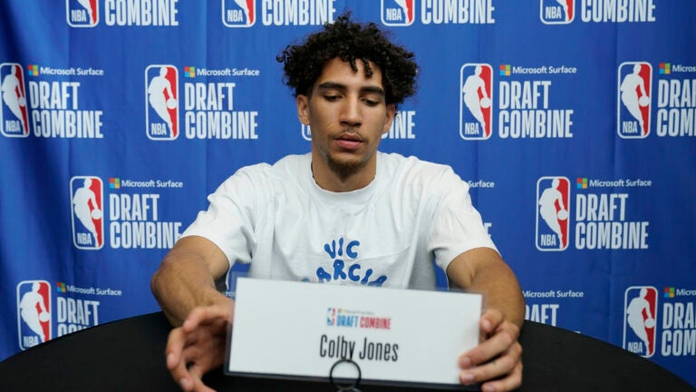 Colby Jones checks his name plate as he waits for the media during the 2023 NBA basketball Draft Combine in Chicago.