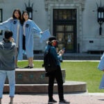 Columbia University class of 2020 graduates pose for photographs on Commencement Day.