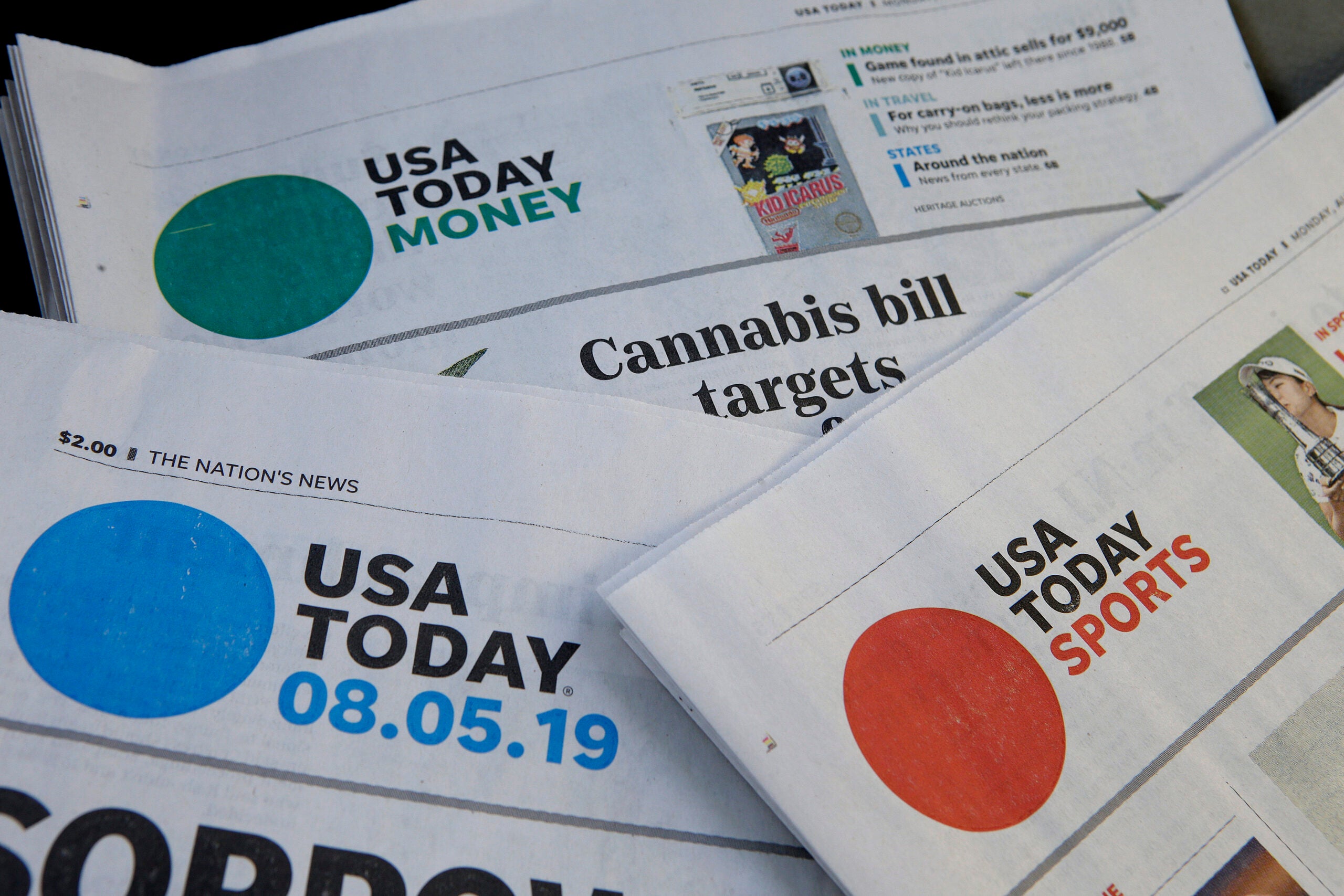 Sections of a USA Today newspaper are displayed