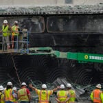 Crews work at the site of a collapsed elevated section of Interstate 95 in Philadelphia.