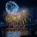 Fireworks explode over the Charles River during the 2022 Boston Pops Fireworks Spectacular.