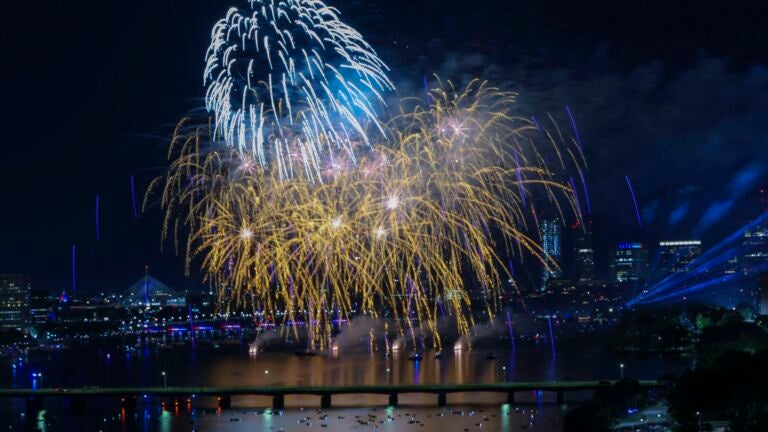 Fireworks explode over the Charles River during the 2022 Boston Pops Fireworks Spectacular.