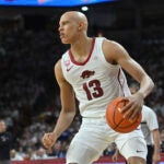 Arkansas guard Jordan Walsh (13) runs a play against Kentucky during an NCAA college basketball game Saturday, March 4, 2023, in Fayetteville, Ark.