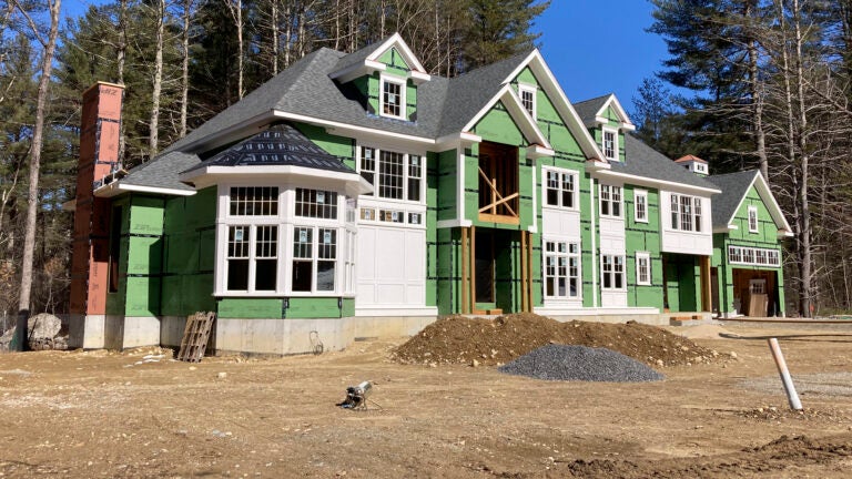 A home under construction is used to illustrate a story on the mortgage rate.