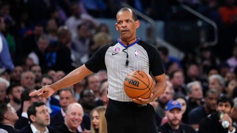 Referee Eric Lewis gestures during the first half of Game 5 of the NBA basketball Eastern Conference semifinal between the New York Knicks and the Miami Heat.