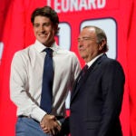 Ryan Leonard shakes hands with commissioner Gary Bettman after being picked by the Washington Capitals during the first round of the NHL hockey draft Wednesday, June 28, 2023, in Nashville, Tenn.