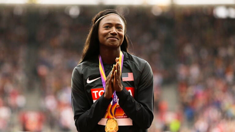 United States' Tori Bowie gestures after receiving the gold medal.