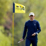 Collin Morikawa lines up a putt on the 14th hole during a practice round for the PGA Championship golf tournament at Oak Hill Country Club.