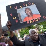 Civil rights attorney Benjamin Crump takes part in a march for Justice for Richard "Randy" Cox from the Stetson Library to the New Haven Police Department.