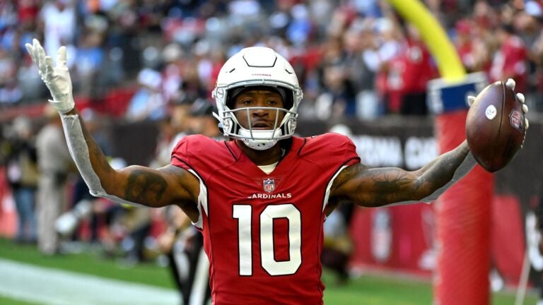DeAndre Hopkins #10 of the Arizona Cardinals celebrates after scoring a touchdown in the first quarter of a game against the Los Angeles Chargers at State Farm Stadium on November 27, 2022 in Glendale, Arizona.