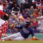 Tampa Bay's Isaac Paredes scores on a fielding error by Masataka Yoshida following a hit by Manuel Margot in fourth inning.