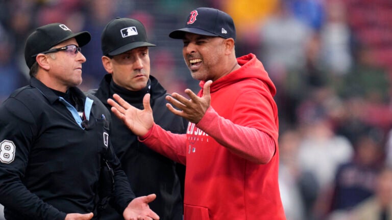 Justin Turner of the Boston Red Sox talks with manger Alex Cora