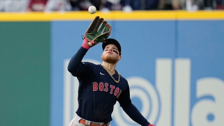 Boston Red Sox right fielder Alex Verdugo catches a fly ball hit by Cleveland Guardians' Myles Straw during the third inning of a baseball game Wednesday, June 7, 2023, in Cleveland.