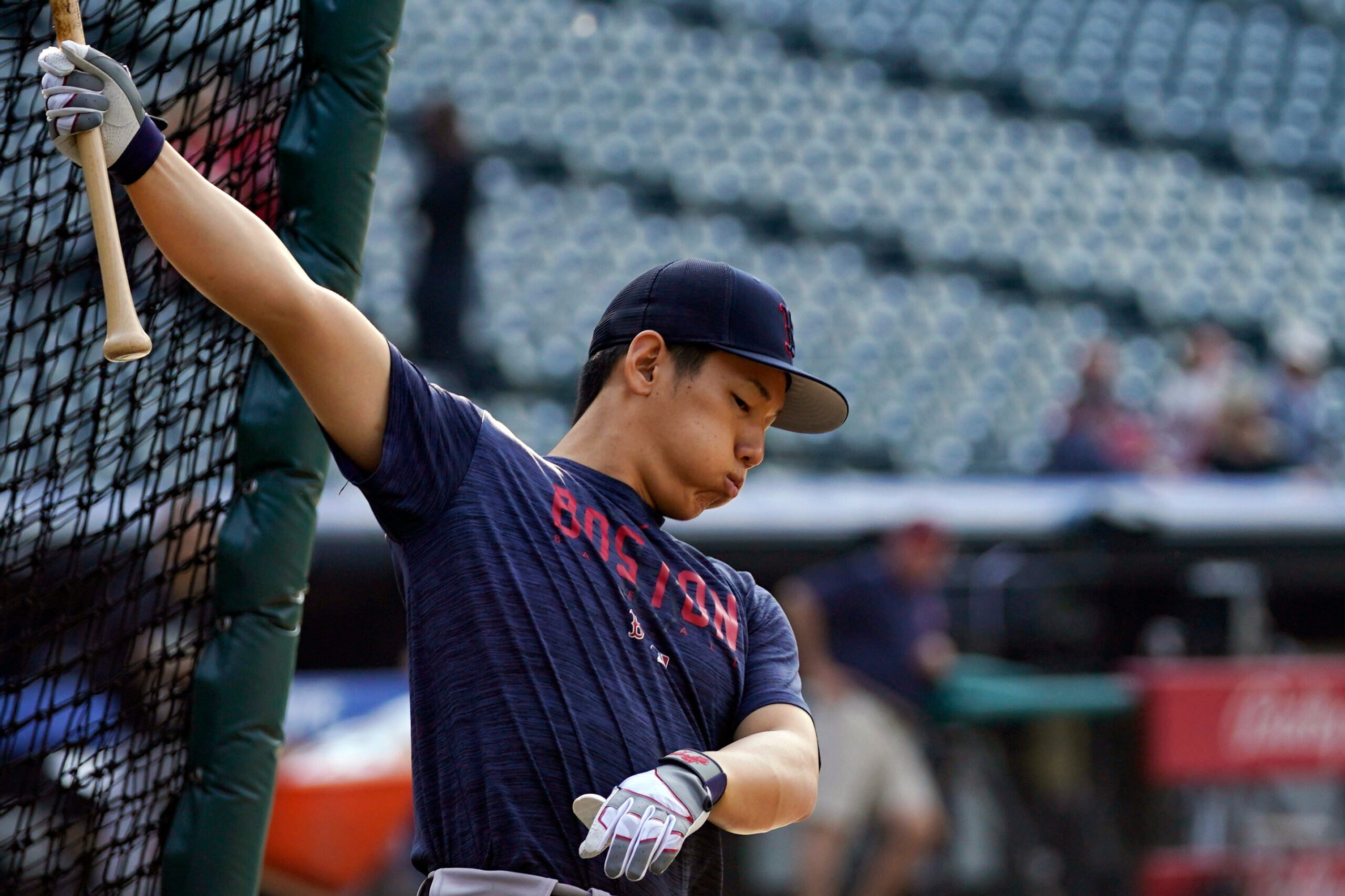 Boston Red Sox outfielder Masataka Yoshida warms up before a baseball game against the Cleveland Guardians.