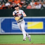 Boston Red Sox second baseman Trevor Story (10) in action during a baseball game against the Baltimore Orioles, Friday, Sept. 9, 2022, in Baltimore.
