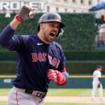 Boston Red Sox's Adam Duvall reacts after scoring on his three-run home run during the sixth inning of a baseball game against the Detroit Tigers, Thursday, April 6, 2023, in Detroit.