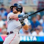 Boston Red Sox's Christian Arroyo hits a single during the second inning of a baseball game against the Minnesota Twins, Tuesday, June 20, 2023, in Minneapolis.