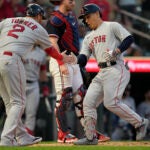 Boston Red Sox outfielder Masataka Yoshida celebrates with DH Justin Turner (2) after hitting a two-run home run against the Minnesota Twins.