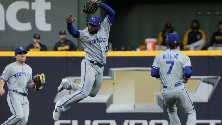 Kansas City Royals' Jackie Bradley Jr. gets out of the way as Bobby Witt Jr. makes a catch.