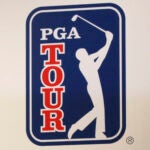 The PGA Tour logo is shown during a press conference in Tokyo.