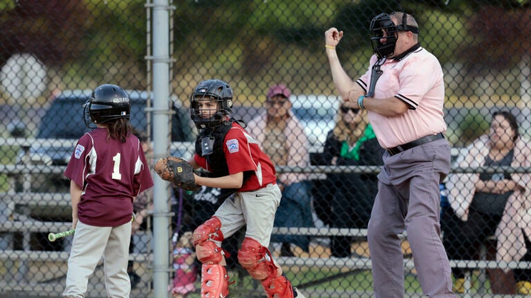Umpire Brian Kennedy makes a call while officiating a game at the Deptford Little League complex in Deptford, N.J.
