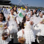 Children dressed as angels march during an Easter parade in Seoul, South Korea, on April 9, 2023.