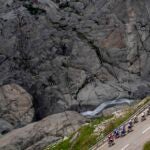 The pack climbs the Furka pass during the fifth stage, a 211 km race from Fiesch to La Punt, of the 86th Tour de Suisse UCI World Tour cycling race in Goms, Switzerland.