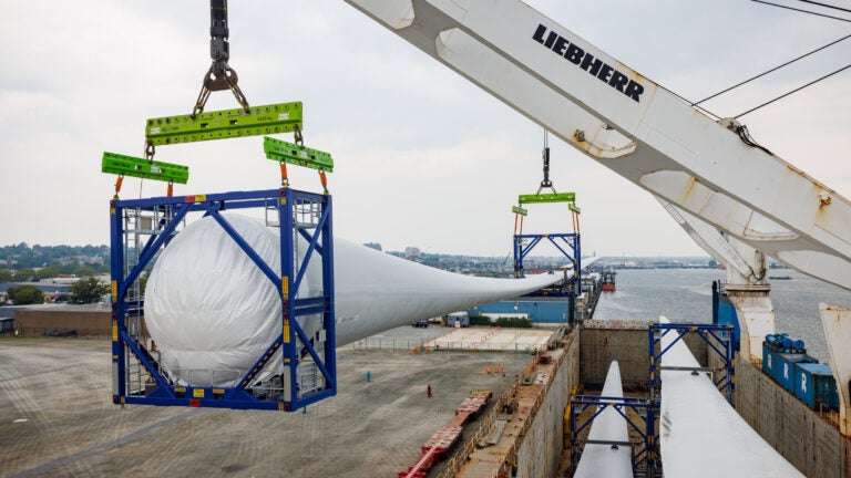 A turbine blade more than 300 feet long built for an offshore wind project at the New Bedford Marine Commerce Terminal.