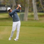 Rickie Fowler hits from the fairway on the second hole during the first round of the U.S. Open golf tournament at Los Angeles Country Club.
