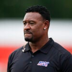 Former NFL football player Willie McGinest Jr. watches the Cleveland Browns during practice at the team's training facility July 31, 2019, in Berea, Ohio.