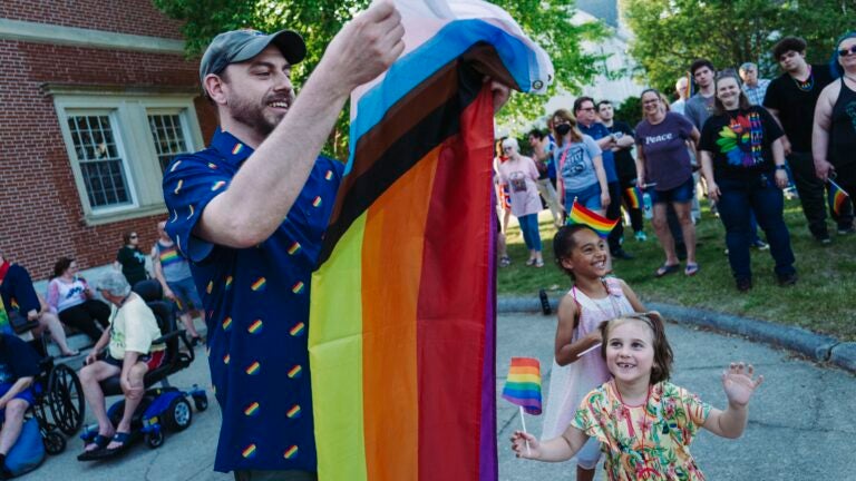 Yaakov “Trek” Reef carried the new Pride Flag to be raised outside the Billerica Public Library during a ceremony on June 1.