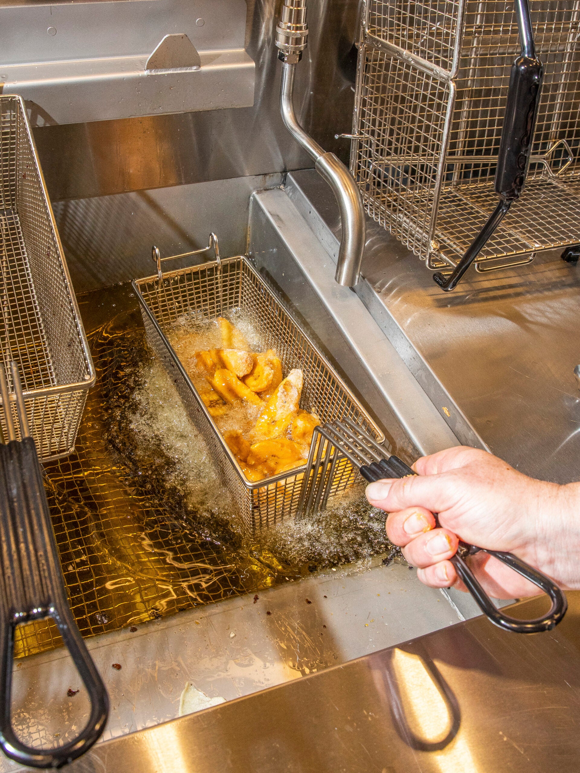 Frying plantains for the mole at the refurbished Casa Bonita in Lakewood, Colo.
