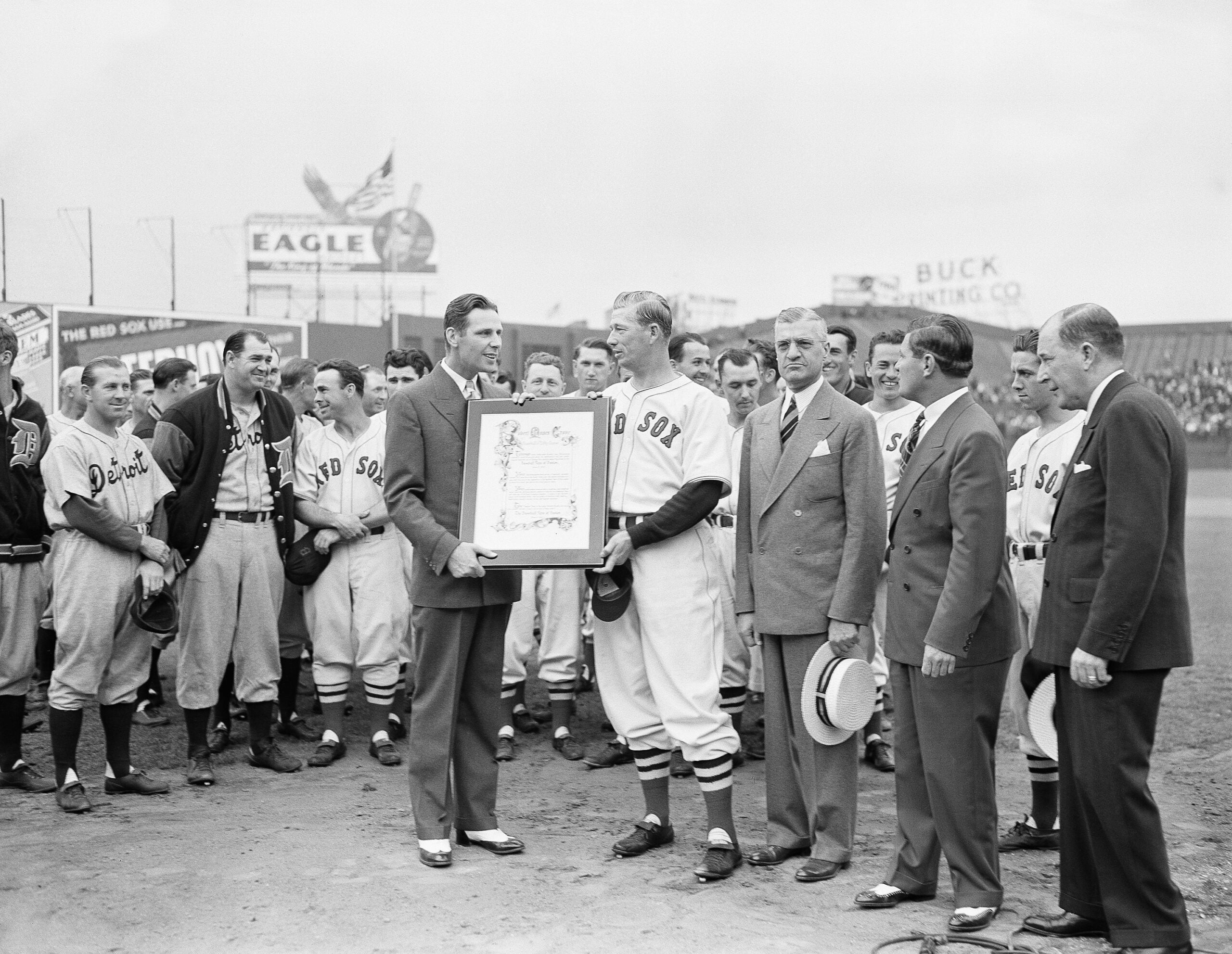Red Sox fans honored Lefty Grove with a plaque at Fenway Park in 1940. It was presented to the veteran pitcher by Mayor Maurice J. Tobin of Boston. Will Harridge, right, president of the American League, was on hand to add his congratulations.