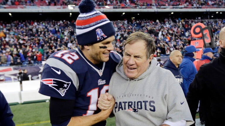 In this Dec. 14, 2014, file photo, New England Patriots quarterback Tom Brady, left, celebrates with head coach Bill Belichick after defeating the Miami Dolphins 41-13 in an NFL football game in Foxborough, Mass.