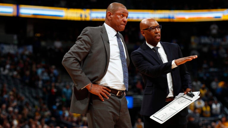 Los Angeles Clippers head coach Doc Rivers and assistant Sam Cassell in the second half of an NBA basketball game Tuesday, Feb. 27, 2018, in Denver. The Clippers prevailed 122-120.